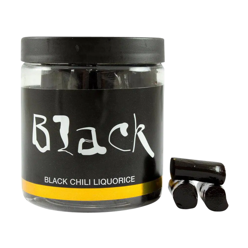 Lakritze mit Chili von Black in durchsichtiger Dose und Lakritze als Deko